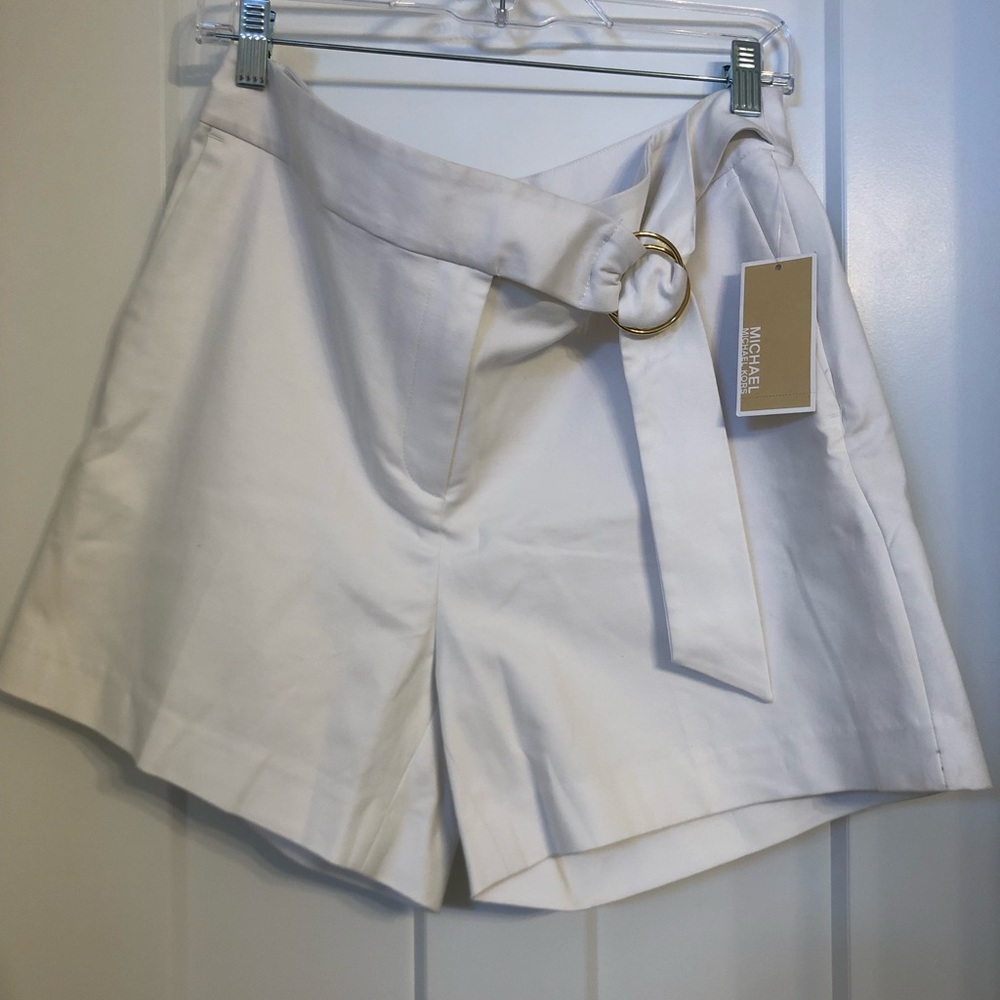 Michael Kors white mid thigh shorts with a built in white belt and gold detail